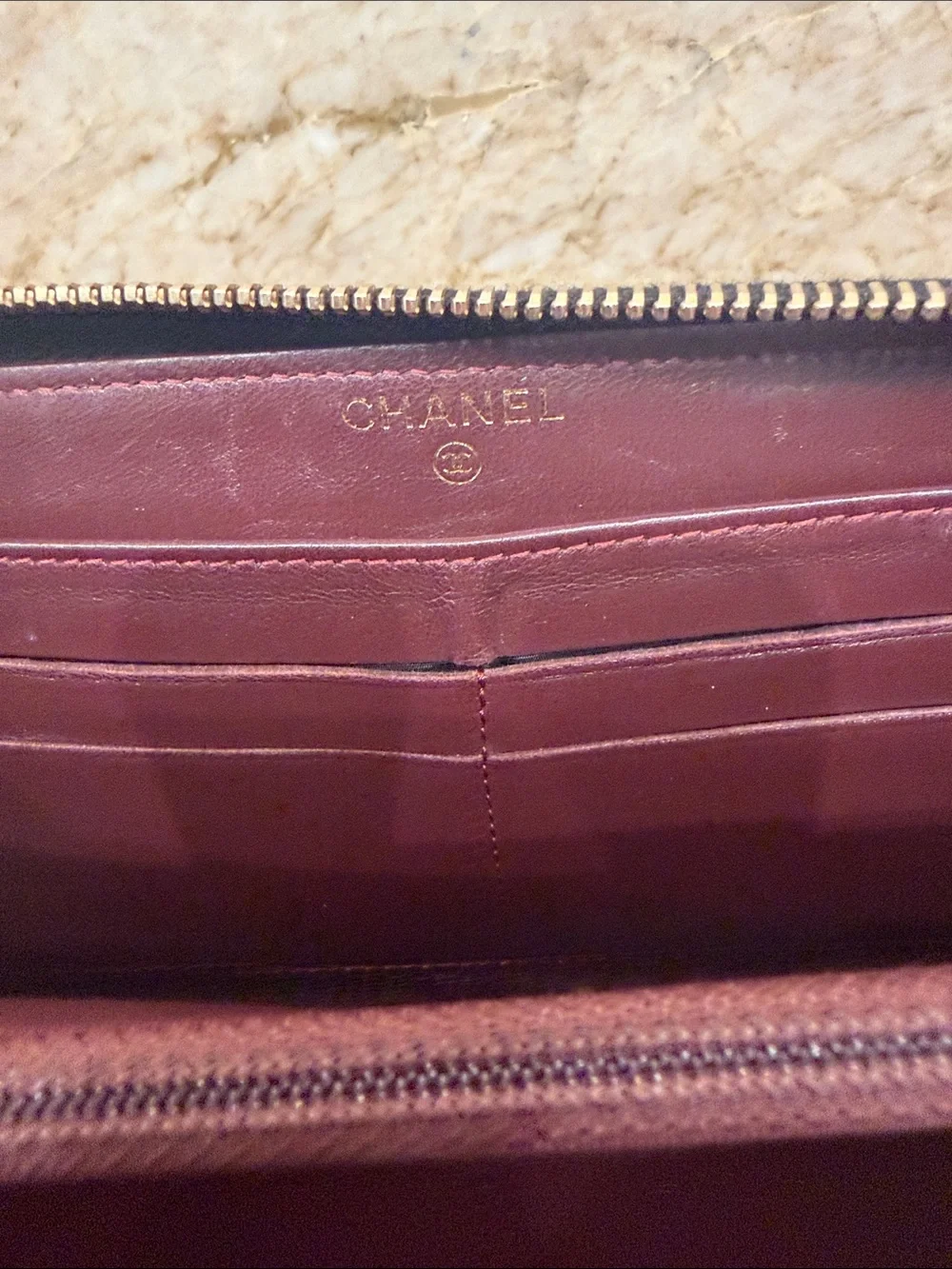 CHANEL Black Quilted Zip-Around Wallet with Gold CC